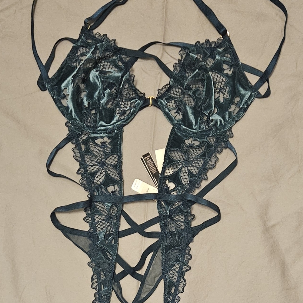 Green Lace Teddy with Intricate Design and Plunging Neckline